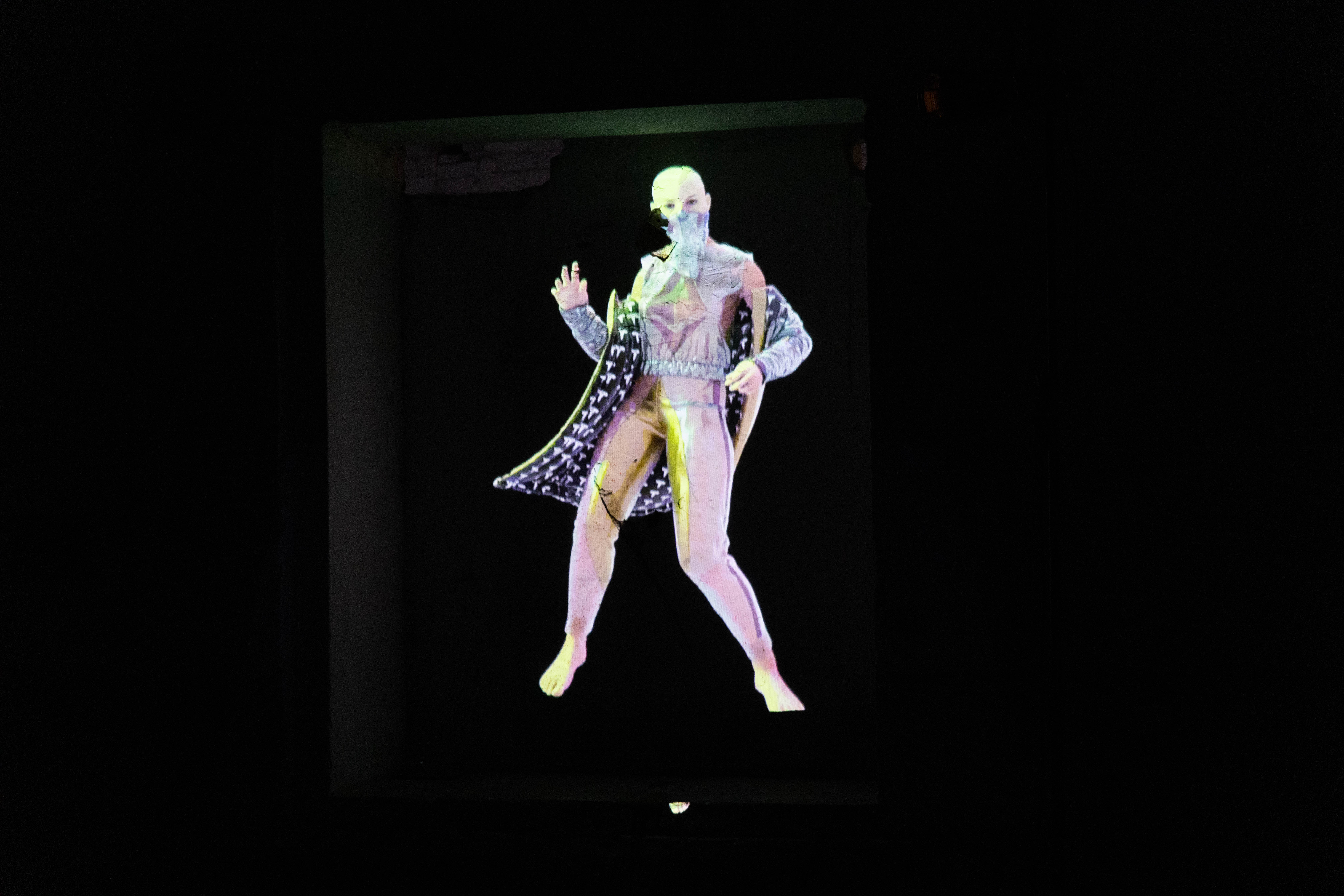 Charter X projected in a dark gallery space, evoking deep space immersion and speculative futurism